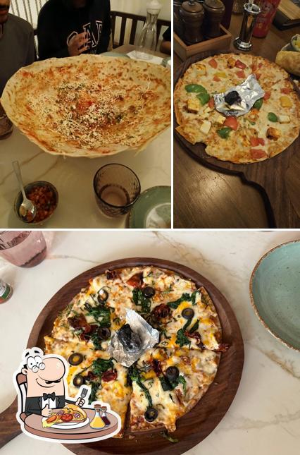 Try out pizza at Thyme & Whisk - Best Restaurant In Indore Pure Veg Restaurant Family Restaurant