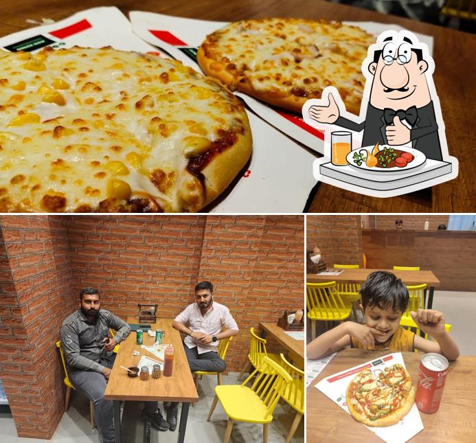 This is the photo displaying food and interior at La Pino'z Pizza Veraval