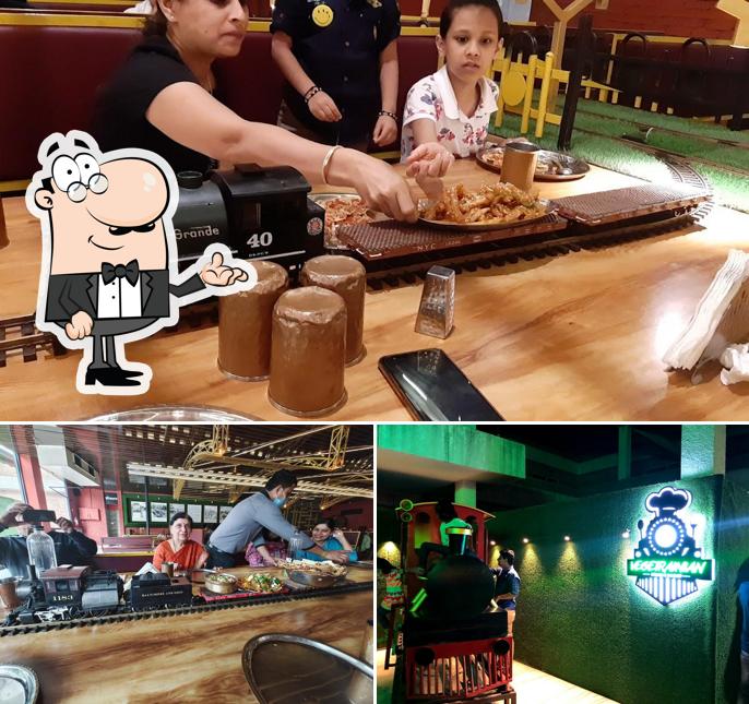Among different things one can find interior and dining table at Vegetrainian - The Train Restaurant