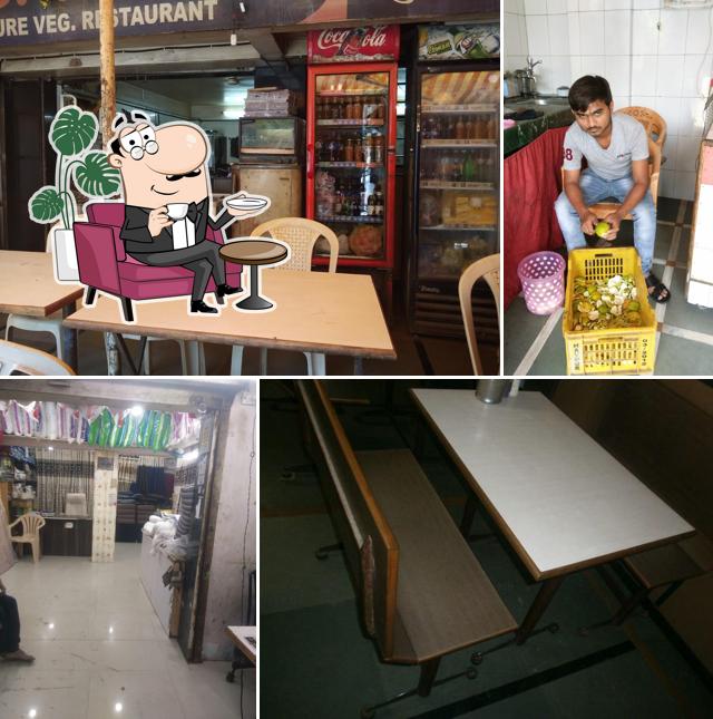 Take a seat at one of the tables at Shabari veg restaurant