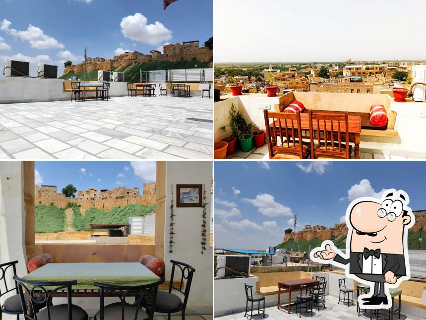 Take a seat at one of the tables at Mariya Cafe Jaisalmer