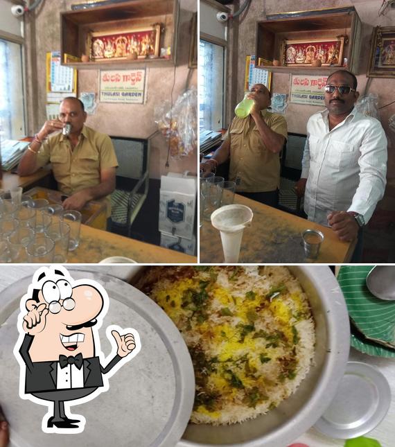 Check out the photo showing interior and food at Thulasi Sri Restaurant & Bar