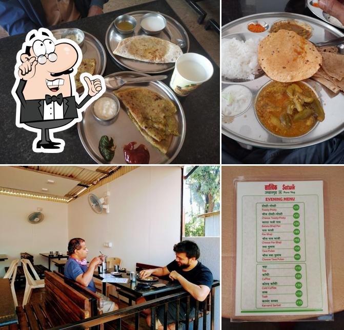 This is the image showing interior and food at Satwik Hotel Pure Veg