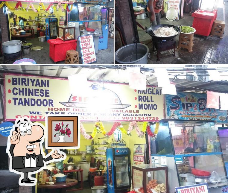This is the image depicting interior and food at Sip & Bite