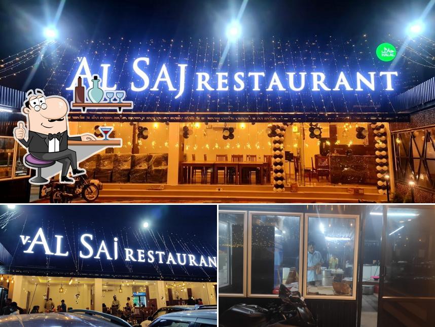 Take a seat at one of the tables at V- Al Saj Restaurant