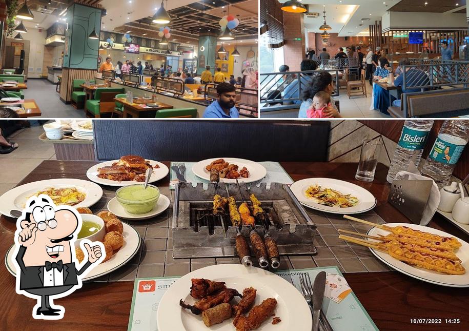 Take a seat at one of the tables at Barbeque Nation