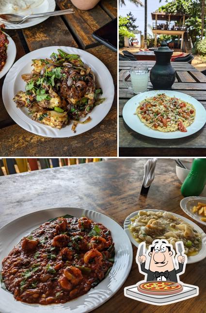 Order pizza at KALIYUGA Toddy Cafe