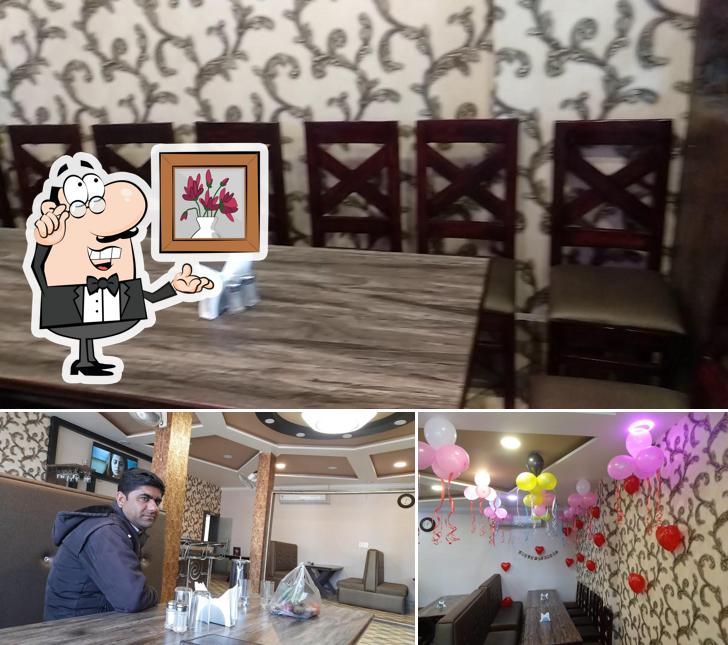 Take a seat at one of the tables at Mantralaya Restaurant