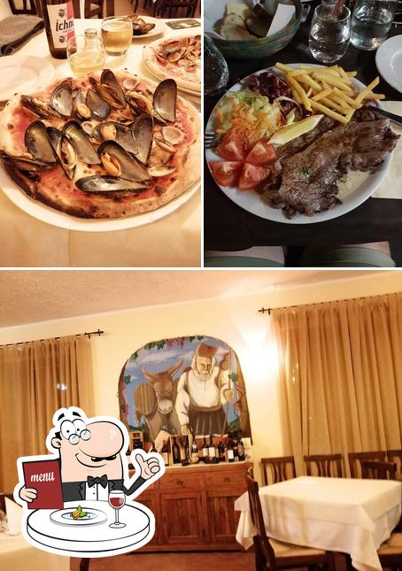 La immagine di cibo e tavolo da pranzo da Ristorante Pizzeria Zanzibar