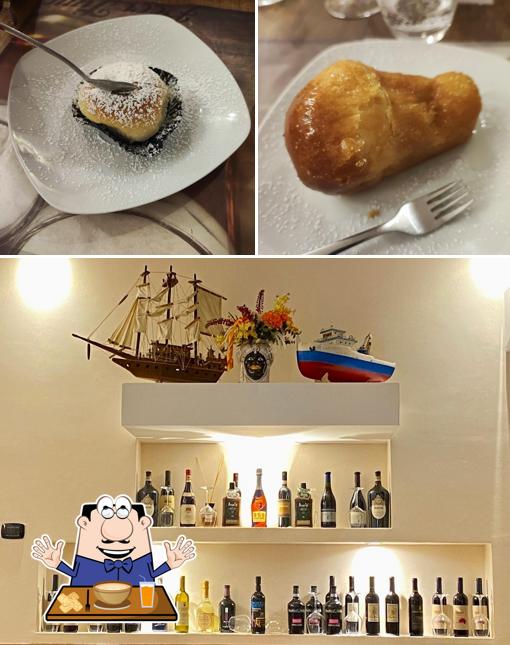 Questa è la immagine che mostra la cibo e interni di A' Lampara