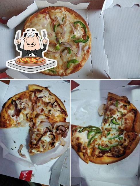 Get pizza at Biggies Restaurant
