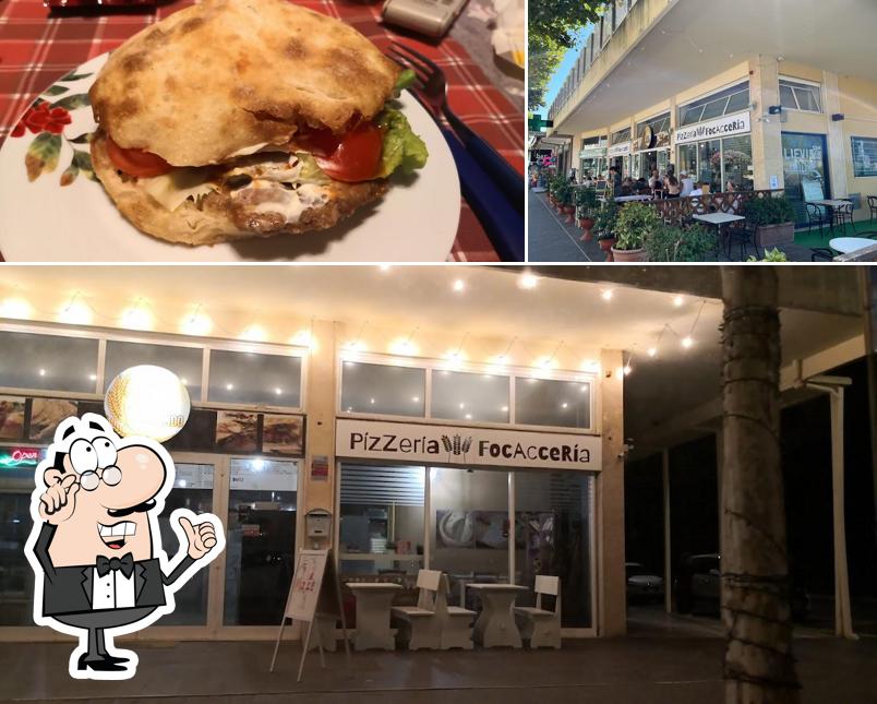 Questa è la immagine che mostra la interni e cibo di Pízzería Focaccería