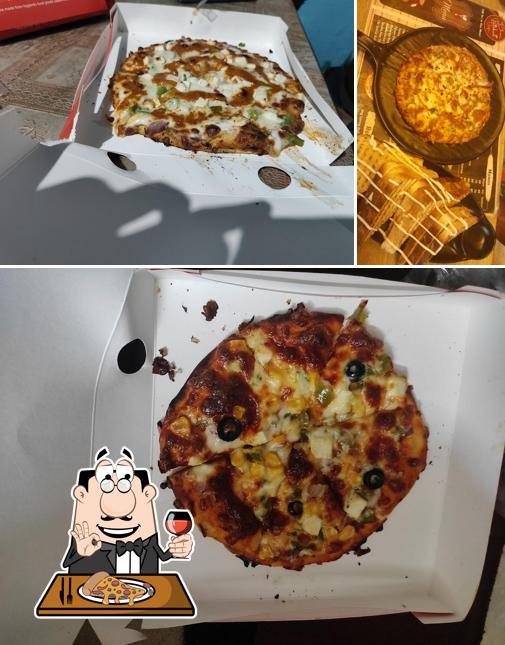 Get pizza at chai biskut cafe