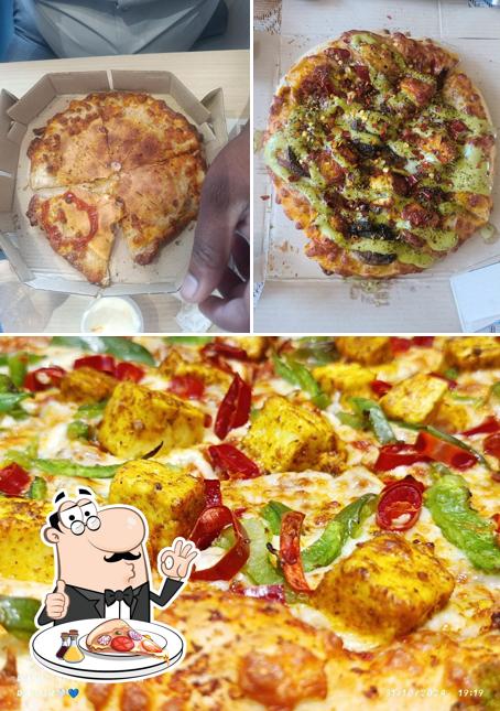 Try out pizza at Domino's Pizza