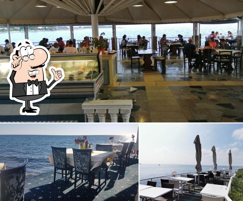 Siediti a un tavolo di Restoran San Marco