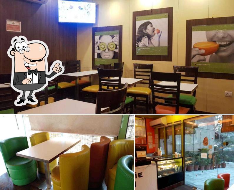 Take a seat at one of the tables at Cottage Café By Smoothie Valley