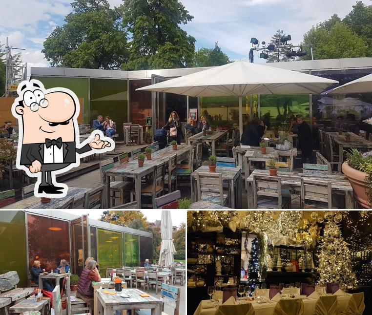 La foto di interni e tavolo da pranzo da Restaurant Kiosk