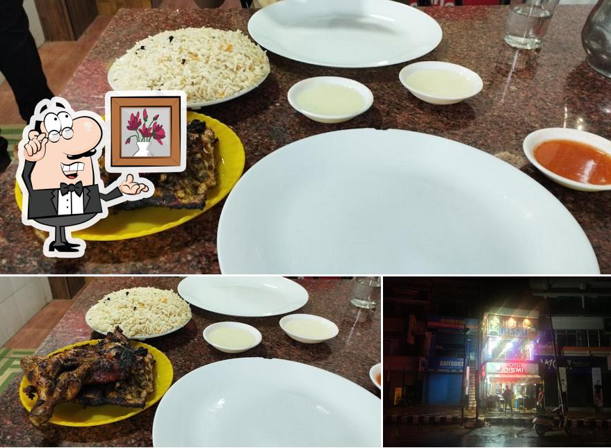 Take a seat at one of the tables at Hotel Bismi