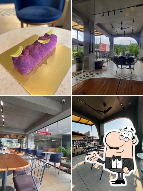Take a seat at one of the tables at ROLUSH cafe pastries Taliparamba
