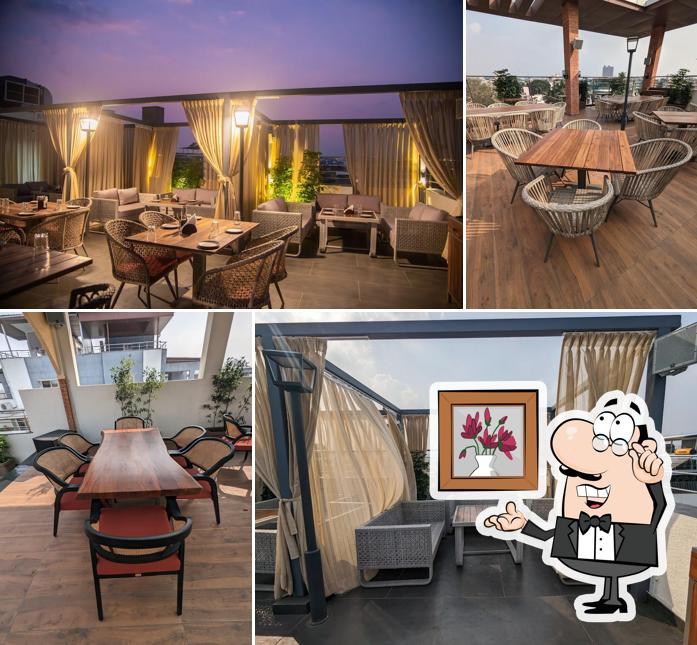 Take a seat at one of the tables at FARO : The Sky Dine