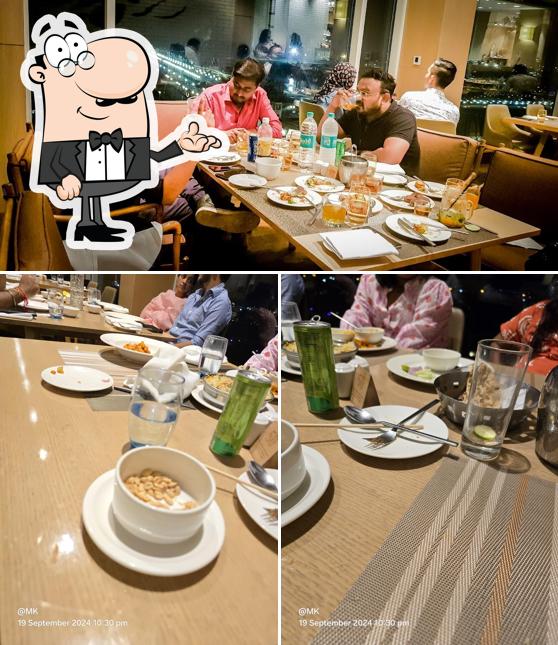 Take a seat at one of the tables at L-14 - All Day Dining and Takeaway