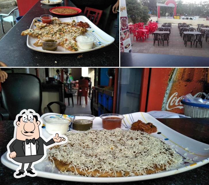 Take a seat at one of the tables at Sai Paratha