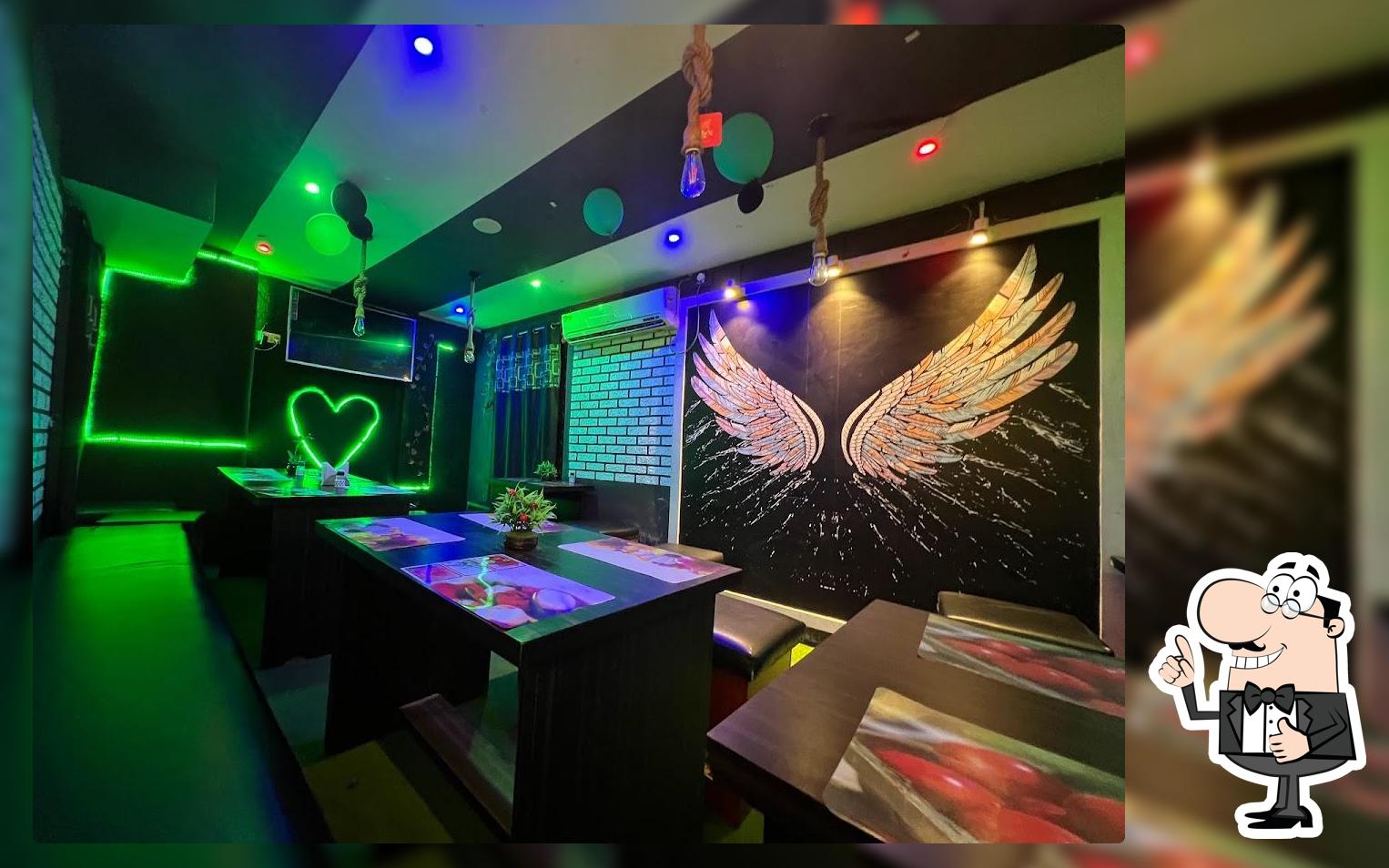 Take a seat at one of the tables at Lessspicy Restaurant