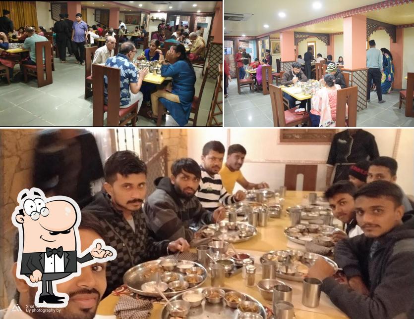 The photo of Vangi Dining Hall - Best Restaurants, Gujarati Thali, Veg Restaurants, Gujarati Restaurants’s interior and dining table