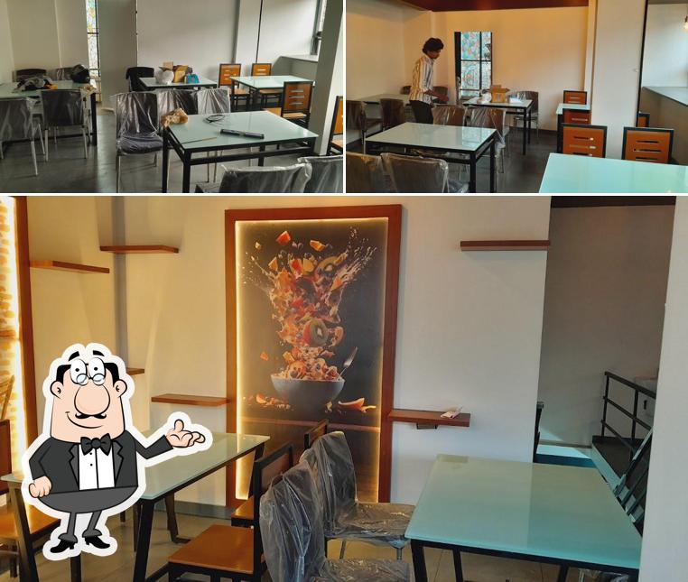 Take a seat at one of the tables at Ela tution center