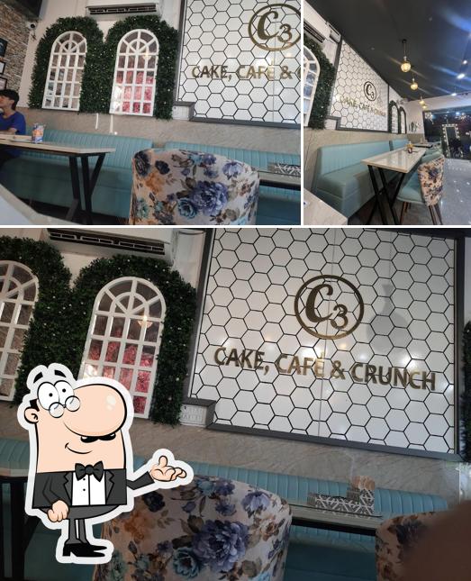 Take a seat at one of the tables at C3:Cake, Cafe' & Crunch