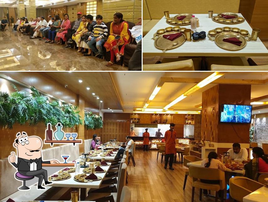 Take a seat at one of the tables at GwalBhog, Motera Chandkheda