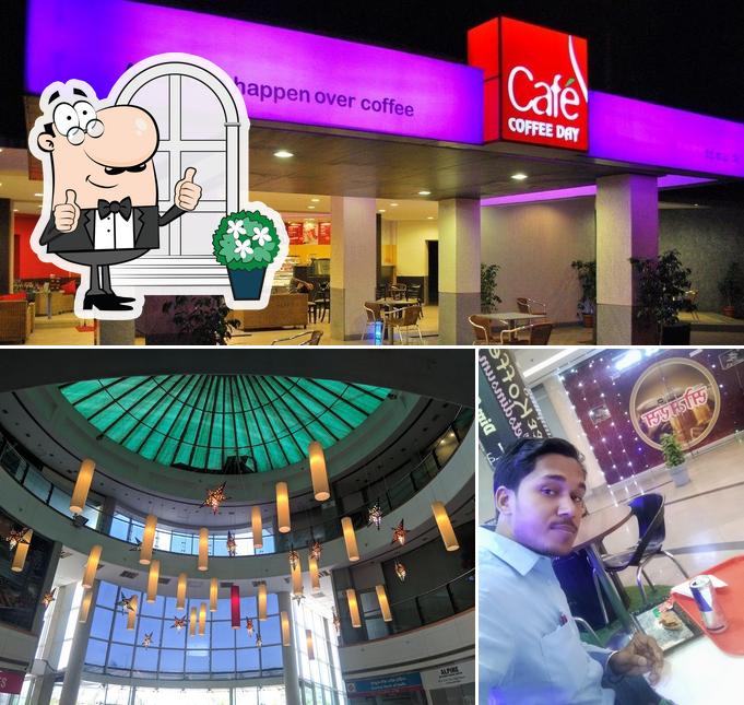 This is the photo depicting exterior and interior at Café Coffee Day