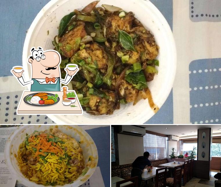 Check out the image showing food and dining table at Adyar Ananda Bhavan - A2B