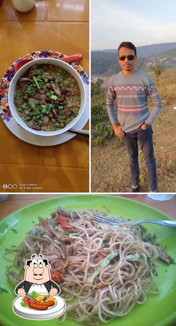 This is the picture displaying food and exterior at Food Planet Restaurant & Guesthouse