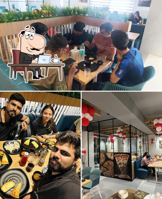 Take a seat at one of the tables at Pizza Burst