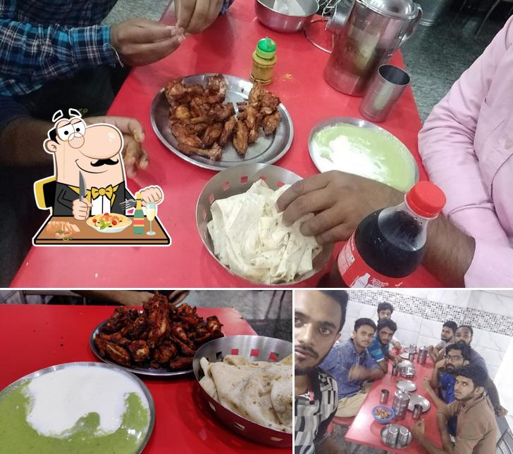 Among different things one can find food and dining table at Al Laziz Shawarma