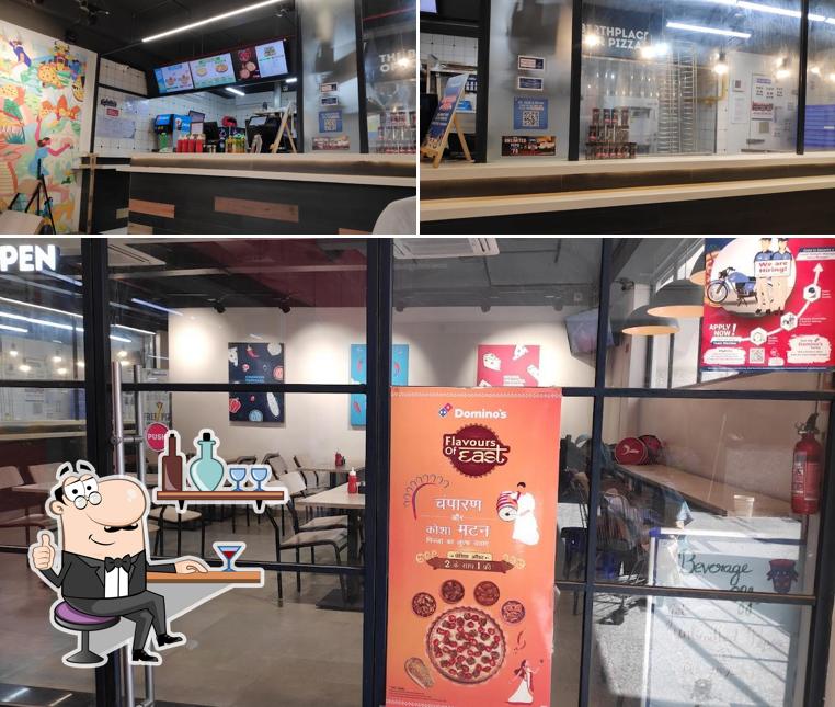 Take a seat at one of the tables at Domino's Pizza Dangra Toli Chowk, Ranchi