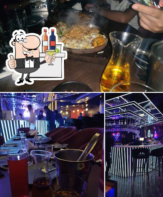 Take a look at the image showing bar counter and food at The Cork Restro Bar