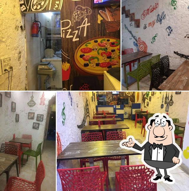 Take a seat at one of the tables at PIZZALICIOUS
