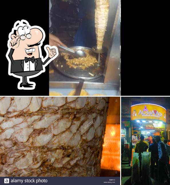 Take a seat at one of the tables at Al Haadi Chicken Shawarma, Chinese & Grill