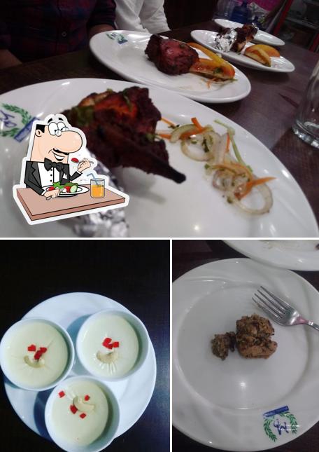 Among various things one can find food and dining table at Mughal Durbar Restaurant