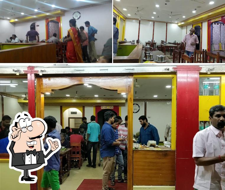 Take a seat at one of the tables at Nasar Idiyappa Restaurant