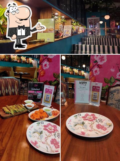 Take a seat at one of the tables at The Sassy Spoon Powai