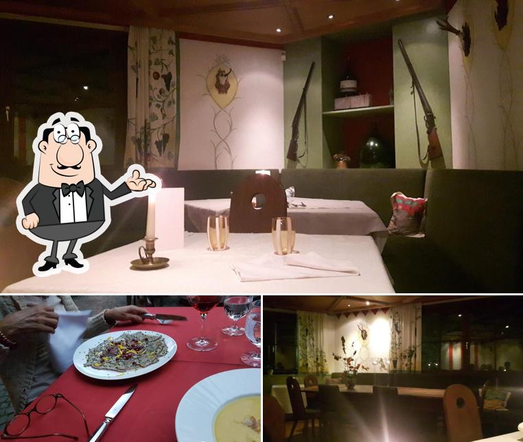 Siediti a un tavolo di Restaurant Turmwirt