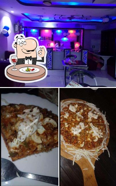 Among different things one can find food and bar counter at Black Beans Jhansi