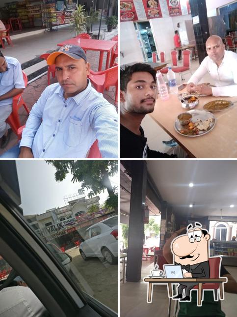 Take a seat at one of the tables at Shivalik Vaishno Dhaba