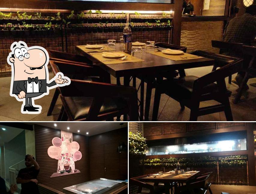 Take a seat at one of the tables at Mustake - Multi Cuisine Restaurant