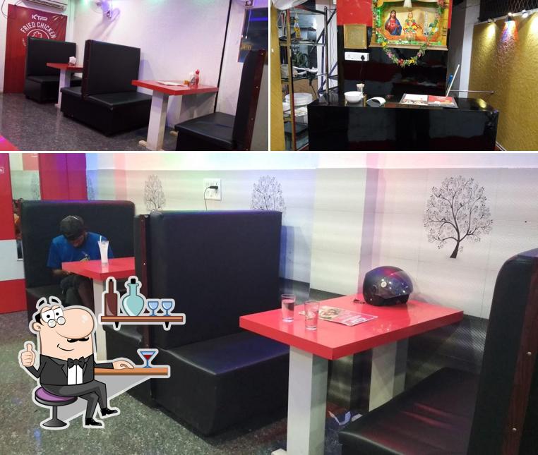 Take a seat at one of the tables at K T P FAMILY RESTAURANT & CHICKEN SHOP