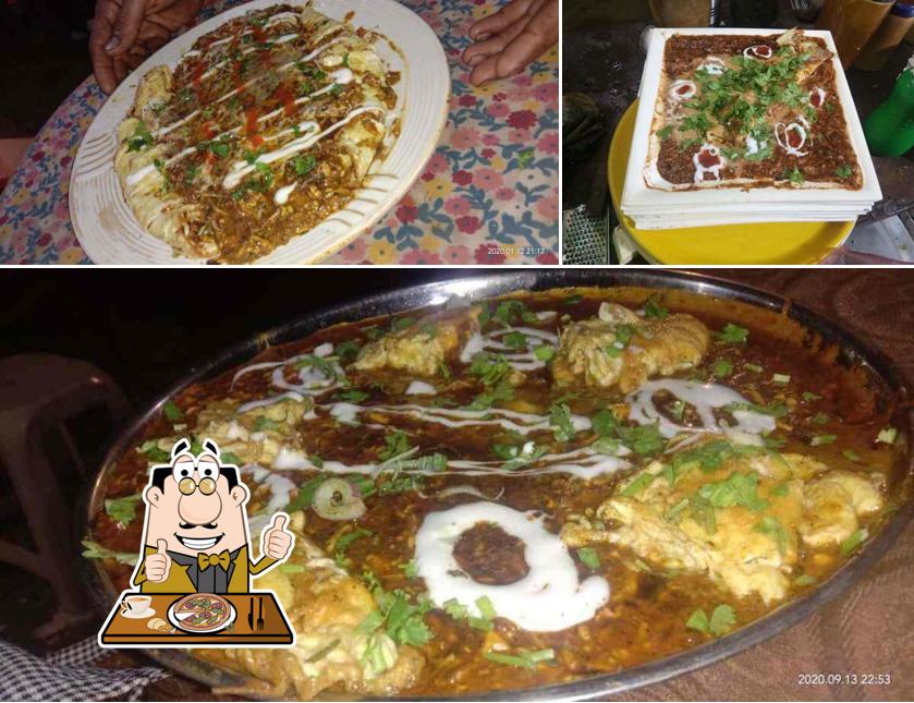 Try out pizza at Indian Omlet Point