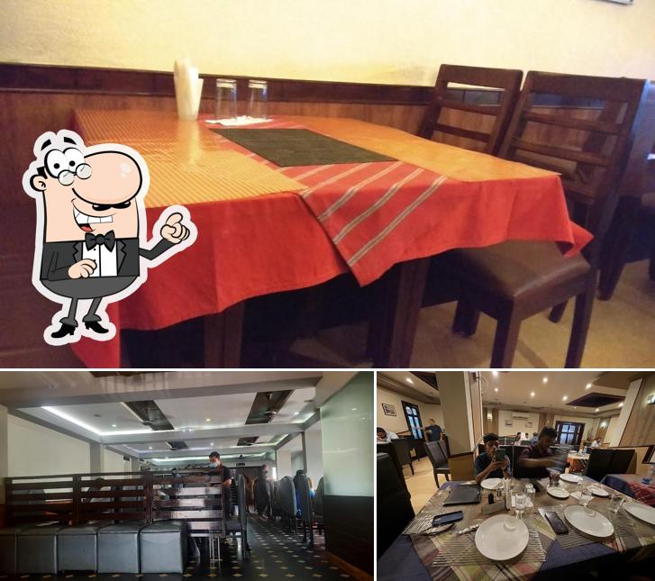 Take a seat at one of the tables at Rara Avis Restaurant